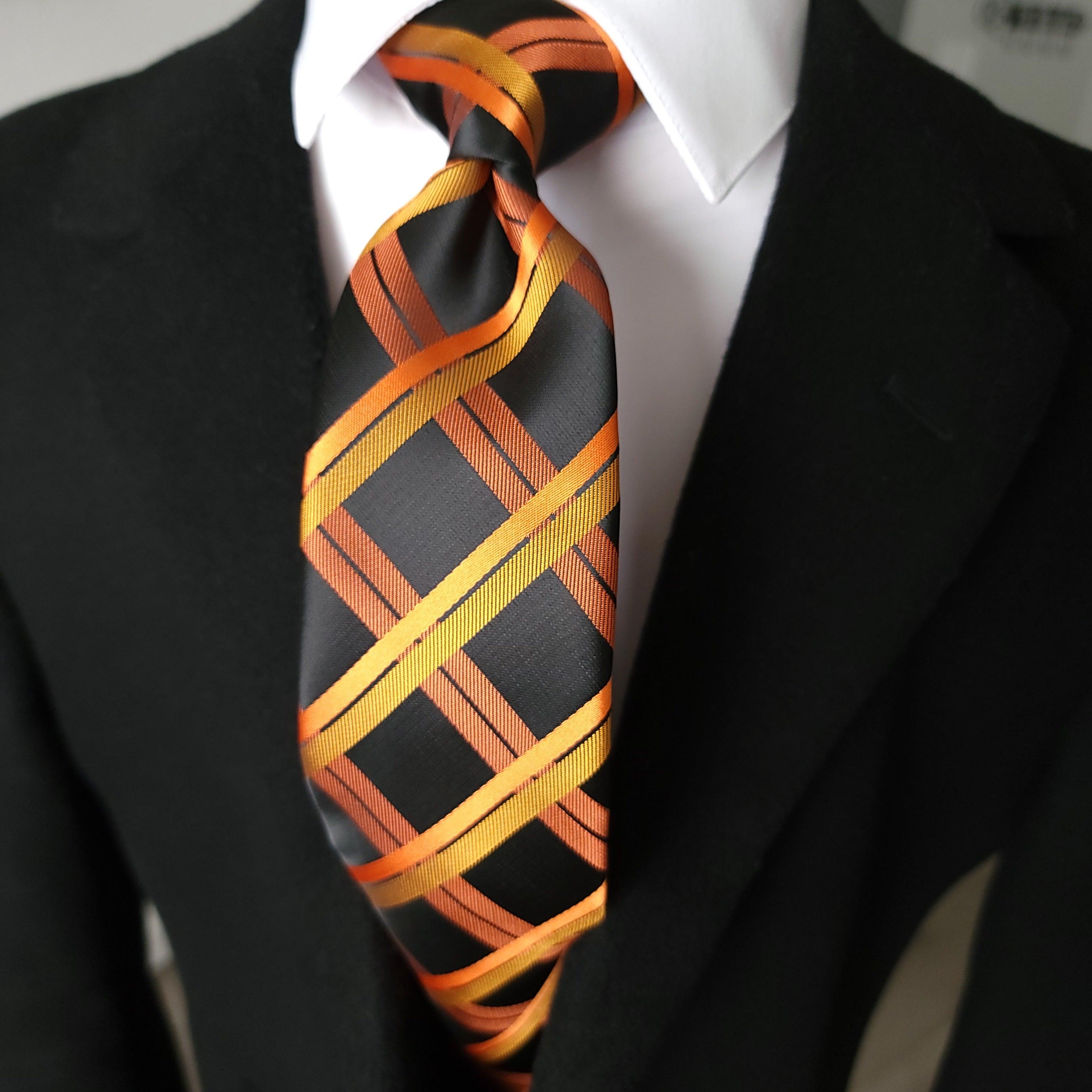 black shirt with orange tie